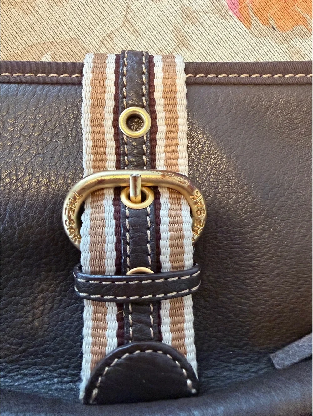 The Sak Brown Leather Shoulder Bag with Striped Strap and Tassel